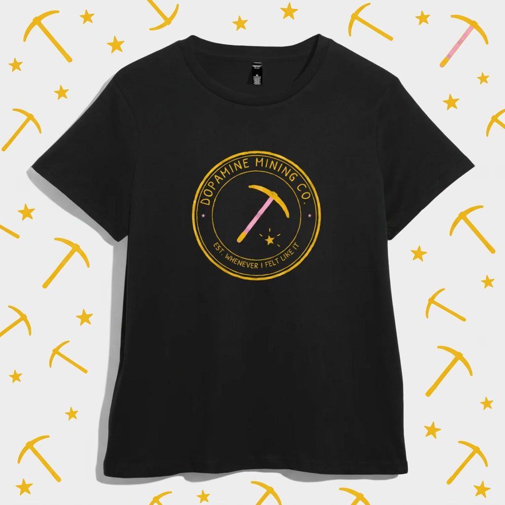 Black women’s t-shirt with a gold circular badge reading Dopamine Mining Co. Est. Whenever I Felt Like It, with a pink-handled pickaxe and a star