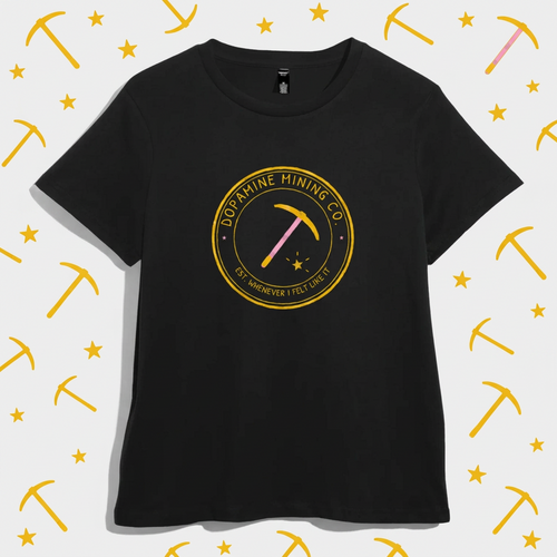 Black women’s t-shirt with a gold circular badge reading Dopamine Mining Co. Est. Whenever I Felt Like It, with a pink-handled pickaxe and a star