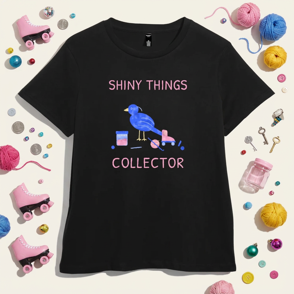 Black women’s t-shirt with a hand-drawn blue bowerbird beside a sourdough jar, yarn, crochet hook and roller skate, with the words Shiny Things Collector in pink